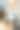 穿毛衣的红发女学生坐在桌子旁使用笔记本电脑图片下载