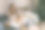 一名年轻女子在装饰着圣诞树和节日彩灯的舒适房间里用智能手机、笔记本电脑和信用卡在线购物。图片下载
