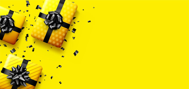 带黑色蝴蝶结的黄色礼品盒。图片下载