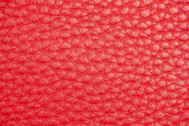 红色皮革织物的抽象背景。近距离图片下载