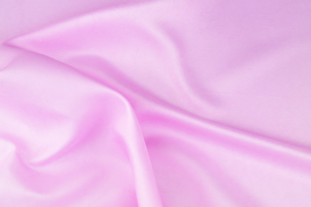 粉红色缎面织物背景。图片下载