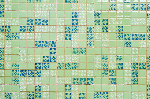 简单纹理的浅色背景建筑墙面，用绿色方形瓷砖图片下载