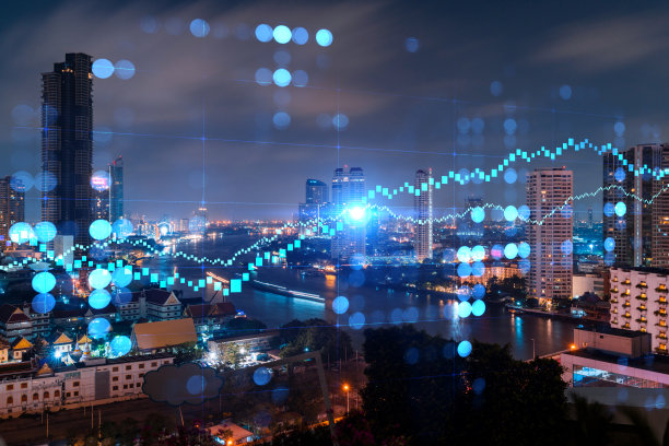 外汇图表全息图，空中夜景曼谷的城市全景，发达的位置为股票市场研究人员在亚洲。基本分析的概念。双重曝光。图片下载