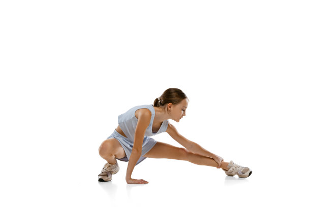 全长侧视图肖像的女孩，青少年做伸展训练前孤立的白色背景图片下载