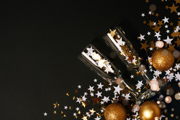 圣诞星星的背景，金色和黑色的辉光图片下载