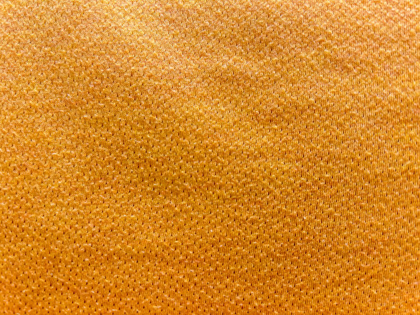 作为背景或质地的浅黄色织物。图片下载