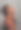 一个迷人的年轻女子在灰色背景下摆姿势的工作室拍摄图片下载
