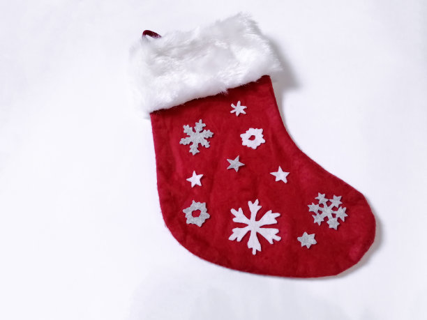 圣诞礼物袜子或白色背景的靴子。圣诞节和元旦。服饰。图片下载