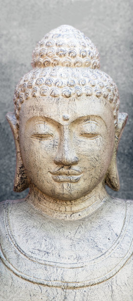 灰色背景的石佛头图片下载