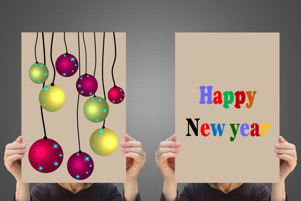 新年快乐!圣诞装饰物两个人手持的装饰标志图片下载