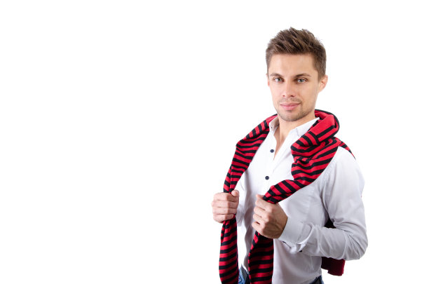 英俊的年轻人。学生与笔记本电脑和平板电脑。图片下载