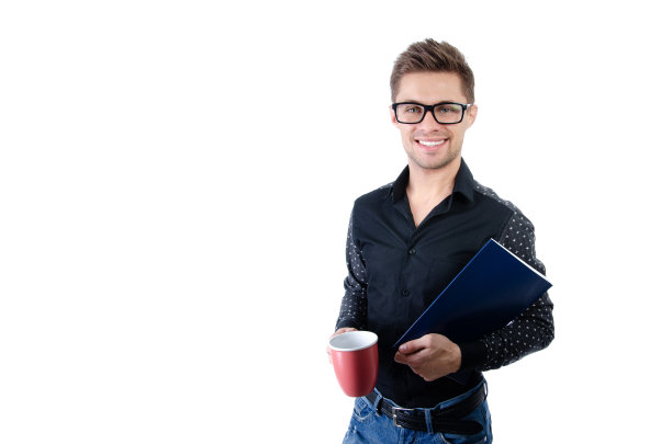 英俊的年轻人。学生与笔记本电脑和平板电脑。图片下载