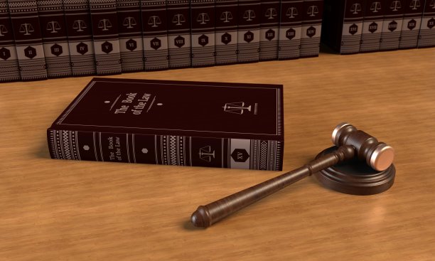 躺着的书和桌子上的法官小木槌。背景是书。三维渲染图片下载