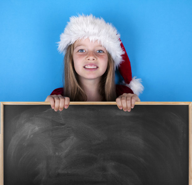 戴着圣诞帽的可爱小女孩图片下载