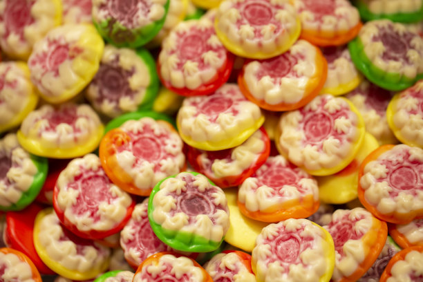 糖果的背景。明亮的糖果特写镜头。彩色红枣背景图案特写图片下载