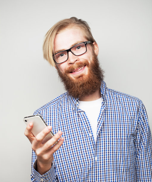 生活方式，科技商业和人的概念:年轻的商人使用手机图片下载