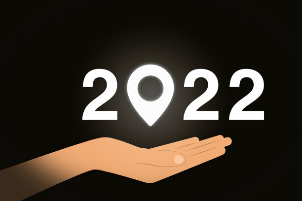 2022年新年快乐。手持别针标志图片下载