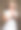 美丽的年轻卷发女孩拿着一个红白棒棒糖和微笑图片下载