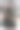 在一个阳光明媚的冬日里，一棵装饰着红色和金色气球的优雅圣诞树矗立在公园里融化的雪地上。圣诞贺卡。新年的街道装饰。图片下载