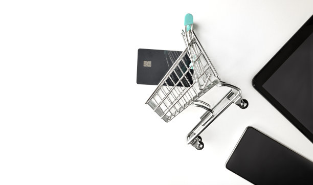 背景与互联网购物的概念与购物车，银行卡和设备图片下载