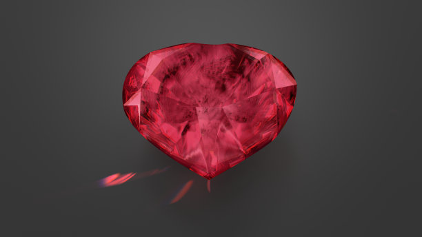 深灰色底色上的红色绿柱石心形宝石图片下载