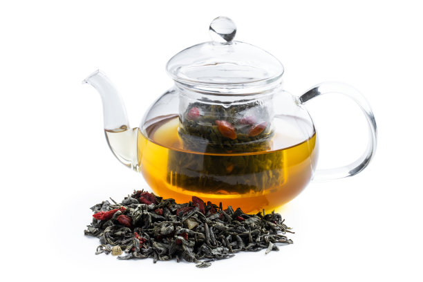 绿茶与枸杞在茶壶孤立的白色图片下载