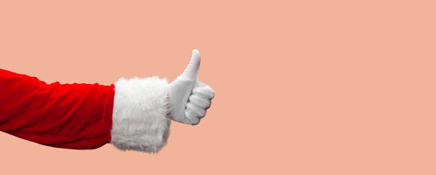 圣诞老人竖起大拇指的手势。图片下载