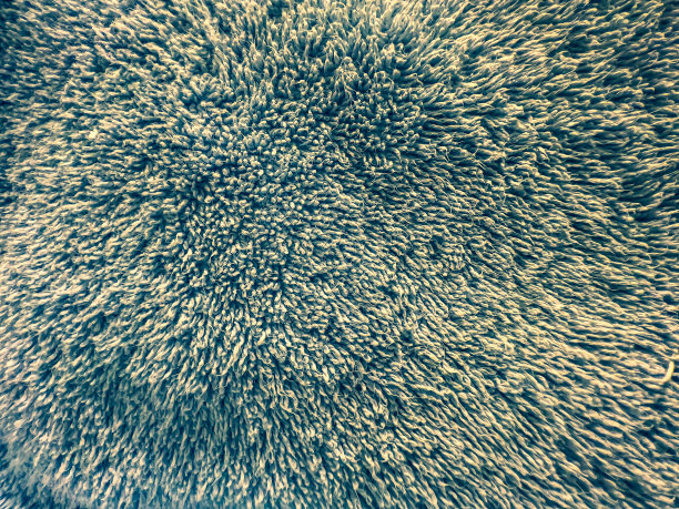 一种作为背景或纹理的浅蓝色、脏的织物。图片下载