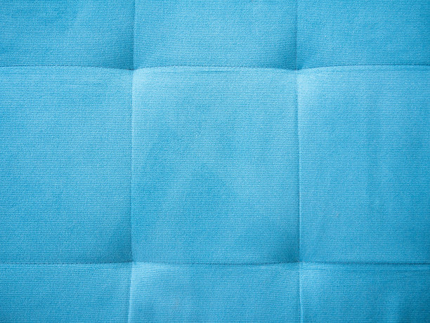 简单的高分辨率蓝色沙发靠垫柔软舒适的背景材质质感，结构特写，背景无人问知。舒适、柔软、舒适抽象概念。俯视图，从上面看到的物体图片下载