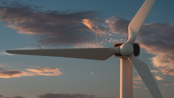 风力涡轮机近距离对风景如画的云的背景。绿色能源的主题图片下载