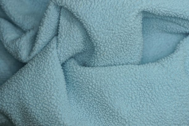 从一块皱巴巴的旧板子上织成的灰蓝色织物图片下载