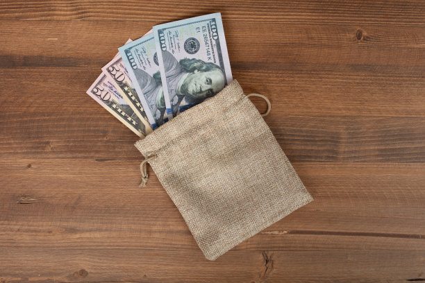 钱袋，背景商业概念和与复印空间为文字或设计。图片下载