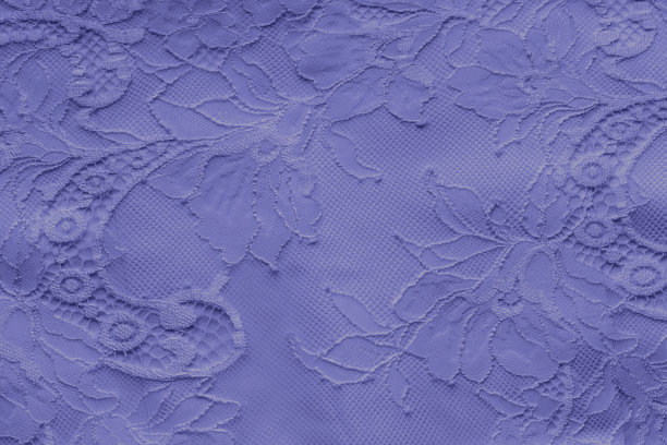 紫蓝色蕾丝在丝绸织物的背景图片下载