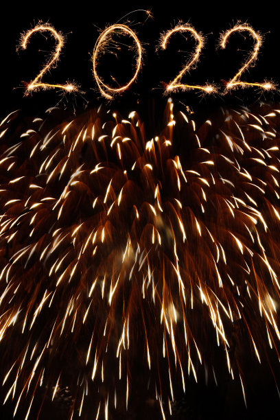 新的2022年与火花在黑色的背景图片下载