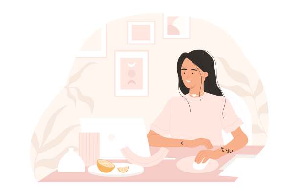 自由职业者在现代的工作环境中工作，粉红色的桌子上摆放着笔记本电脑、花瓶和植物。自由职业者远程工作，在线学习概念。矢量插图在卡通风格。孤立的白色背景。图片下载