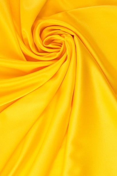 垂挂黄色丝绸织物的缎纹编织，纹理，背景图片下载