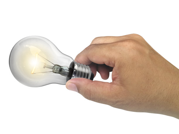 手上的灯泡在白色背景上孤立图片下载