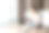 一个年轻的微笑着的漂亮女人翻阅着一本书。旁边的地板上有一台笔记本电脑和一些纸。副本的空间。在线课程和在线学习的概念图片下载
