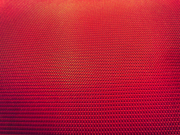 红色织物作为背景或纹理。图片下载