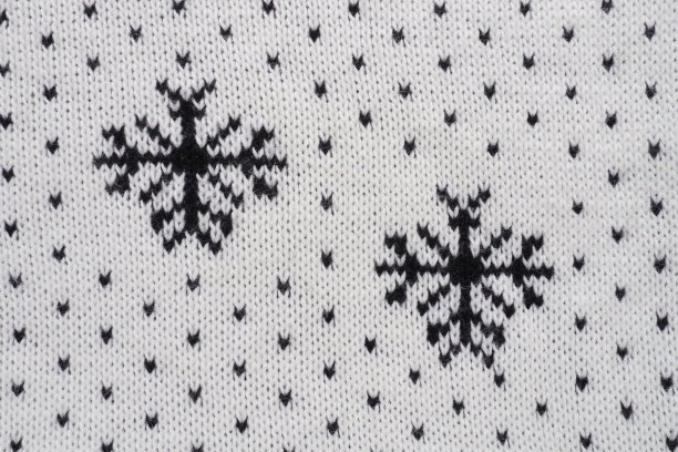 提花针织图案。圣诞节或新年的几何装饰。在白色的背景上编织黑色的雪花和圆点。冬季时尚现代传统民间服饰点缀图片下载