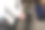 商务与演讲主题:穿着白色夹克的男子手持黑色麦克风。垂直图图片下载
