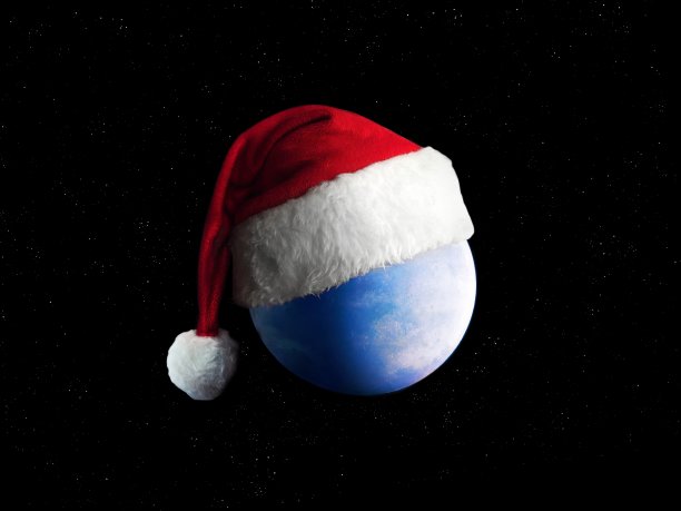 圣诞老人帽子上的蓝色星球。新年地球进入太空。图片下载
