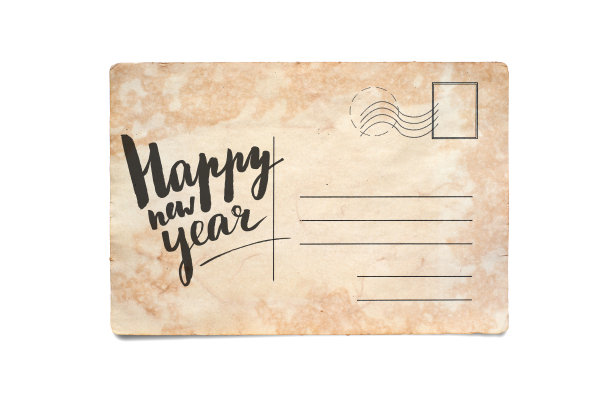 新年快乐。在一张老式明信片上刻字。孤立在白色图片下载