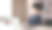 快乐的亚洲商人CEO的肖像西装坐在工作桌前，看着镜头在现代房间的工作场所。图片下载