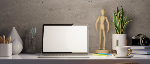 现代阁楼工作空间与笔记本电脑模型，摄影师，网络博客或设计师办公桌。图片下载