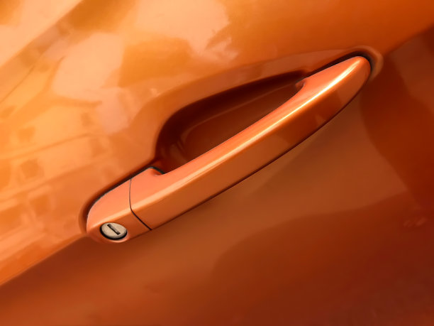 近景摘要的门的现代汽车显示门把手与钥匙孔。图片下载