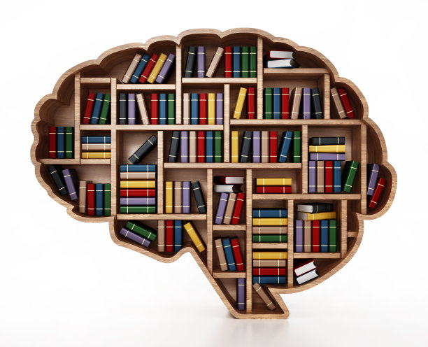 脑型图书馆的书架上摆放着一叠彩色书籍图片下载