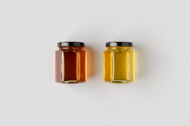 六边形的蜂蜜罐模型。两个不同的颜色。图片下载