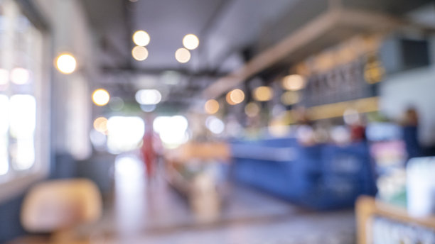 模糊的购物中心背景的商店杂货。模糊背景购物商场灯光散景商业活动零售商店。模糊会展中心观众现展示商品货架产品图片下载