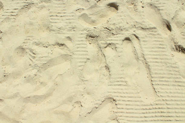 沙滩上的痕迹背景图片下载